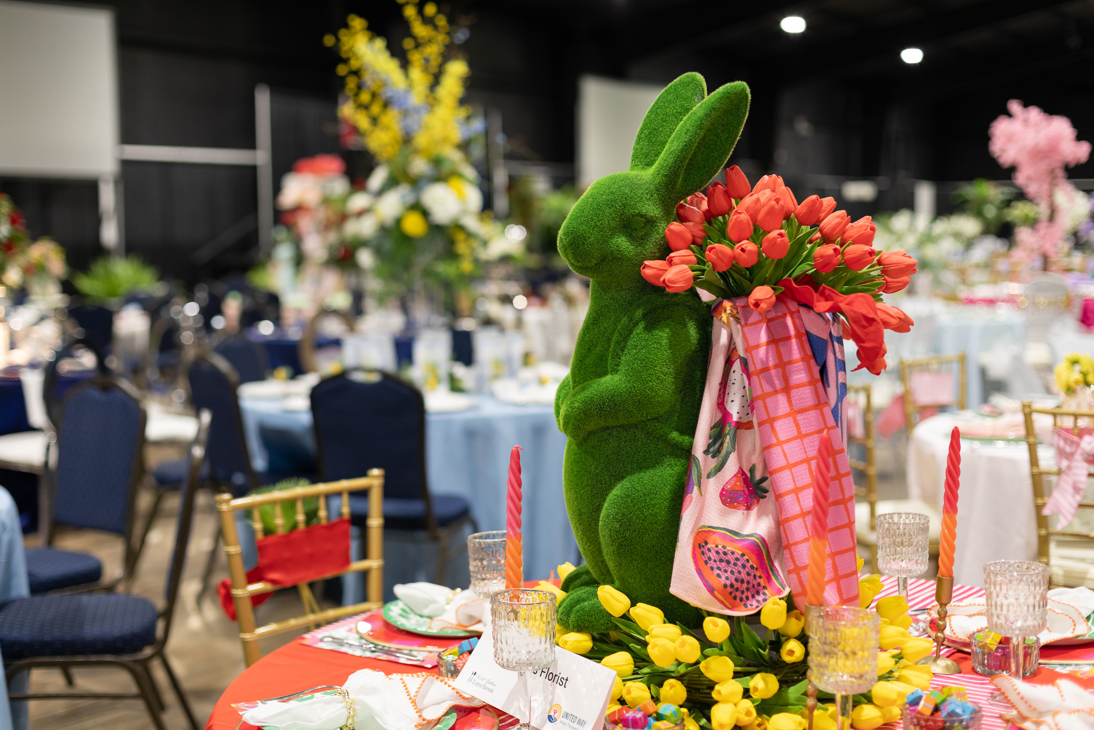 A table with tulips and a bunny centerpiece