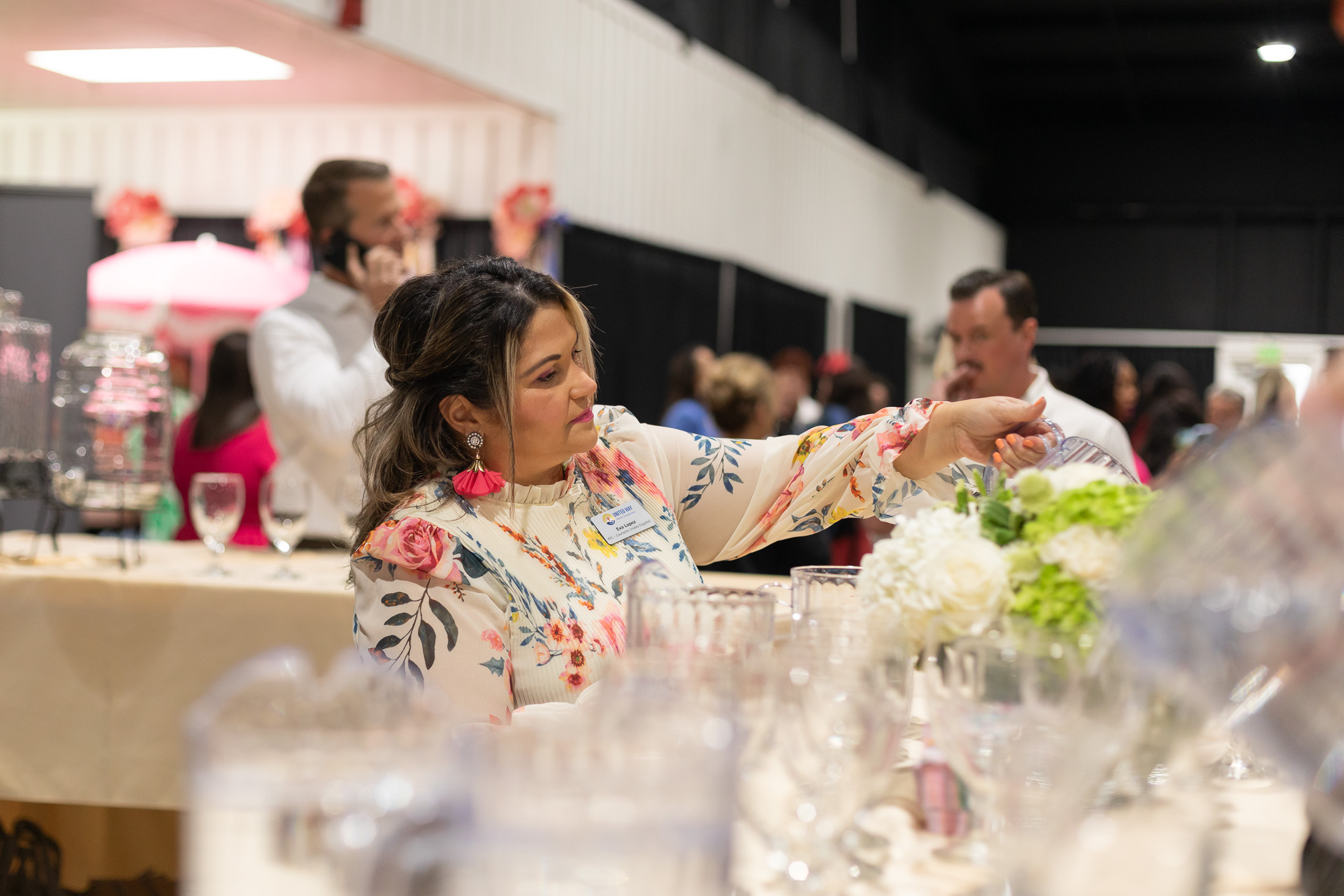 A photos of a woman making drinks
