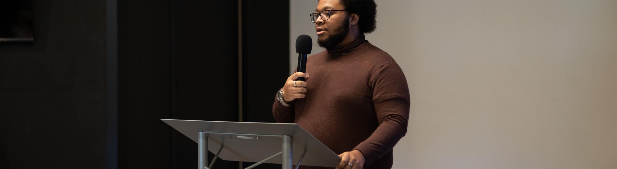 student leading a meeting