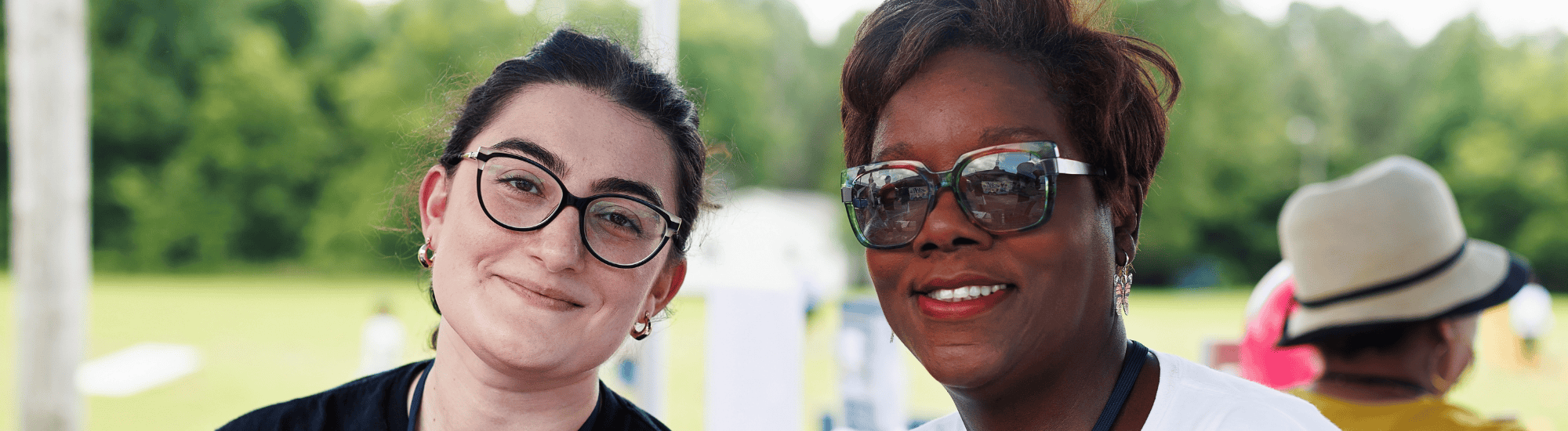Two women are at a community event.