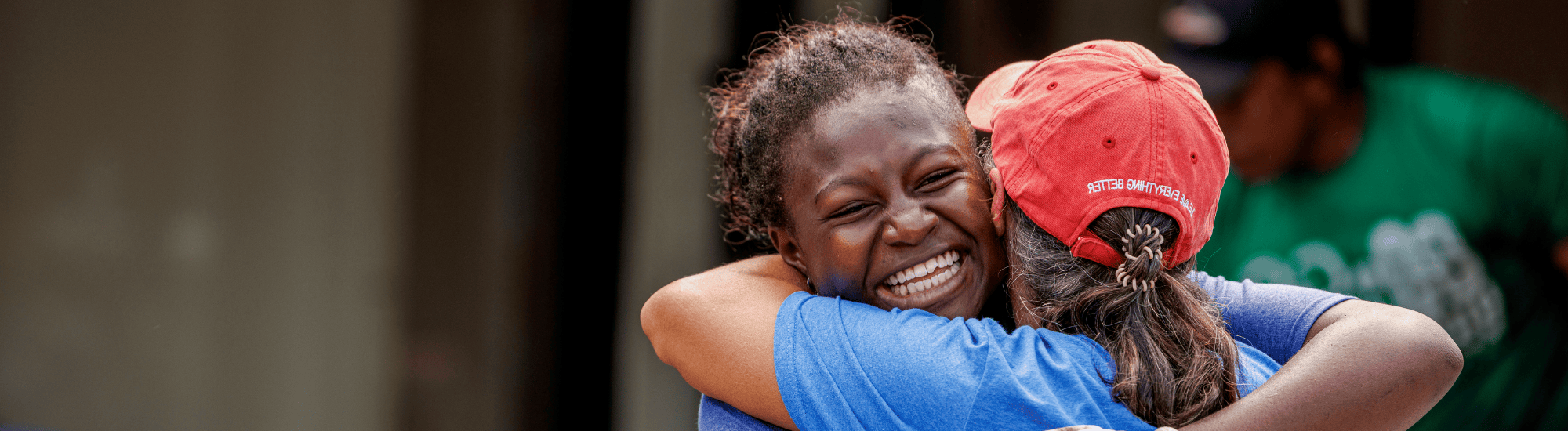 Two women are hugging.